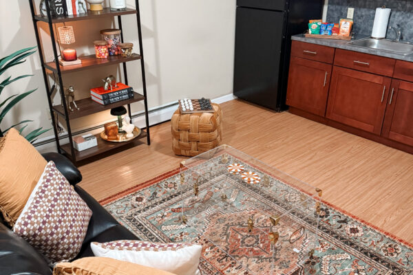 Modern appliances and finishes included in all units Modelled unit with cabinet stand, love sofa, coffee table and kitchen and modern fridge