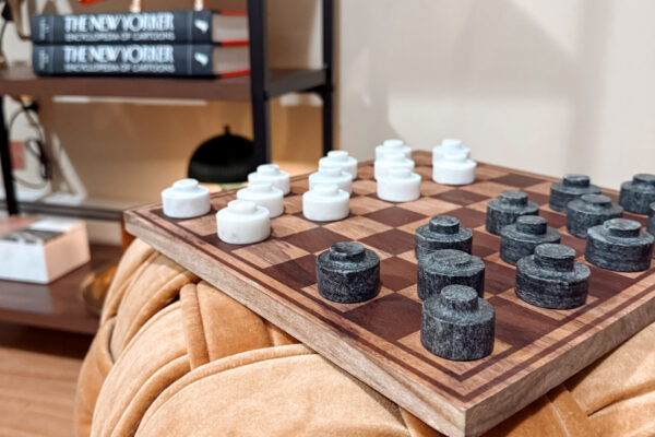 Amenities include sofa/love seat, sofa chair Chess board on top of cushion stool